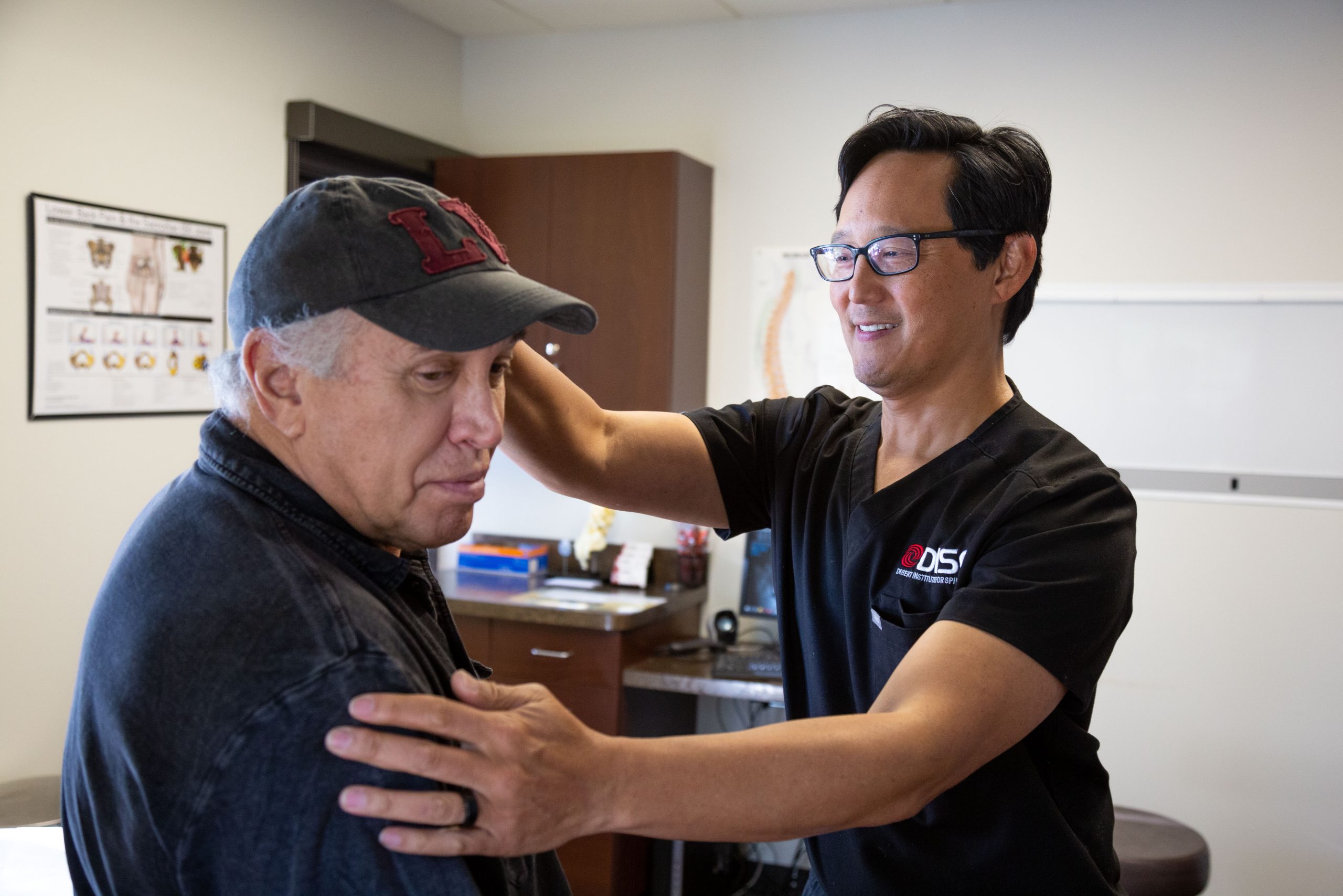 Dr. Chris Yeung with Elderly Patient