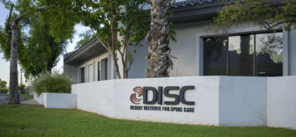 A White Sign That Says DISC On It